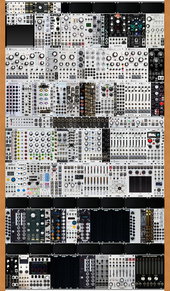 Volkskabinett 16U x 120HP (with 1U to 3U adaptor) + two Pod64x skiffs + passive routing pod + hacker pod (copied from adamj)
